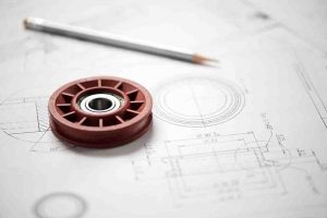 Plastic wheel bearing on blueprint